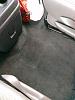 What is under the carpet between driver and passenger seats?-imag5129.jpg