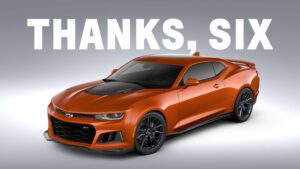 Front 3/4 view of the 2023 Chevrolet Camaro ZL1 1LE in Vivid Orange Metallic staged under white text reading, “Thanks, Six.”
